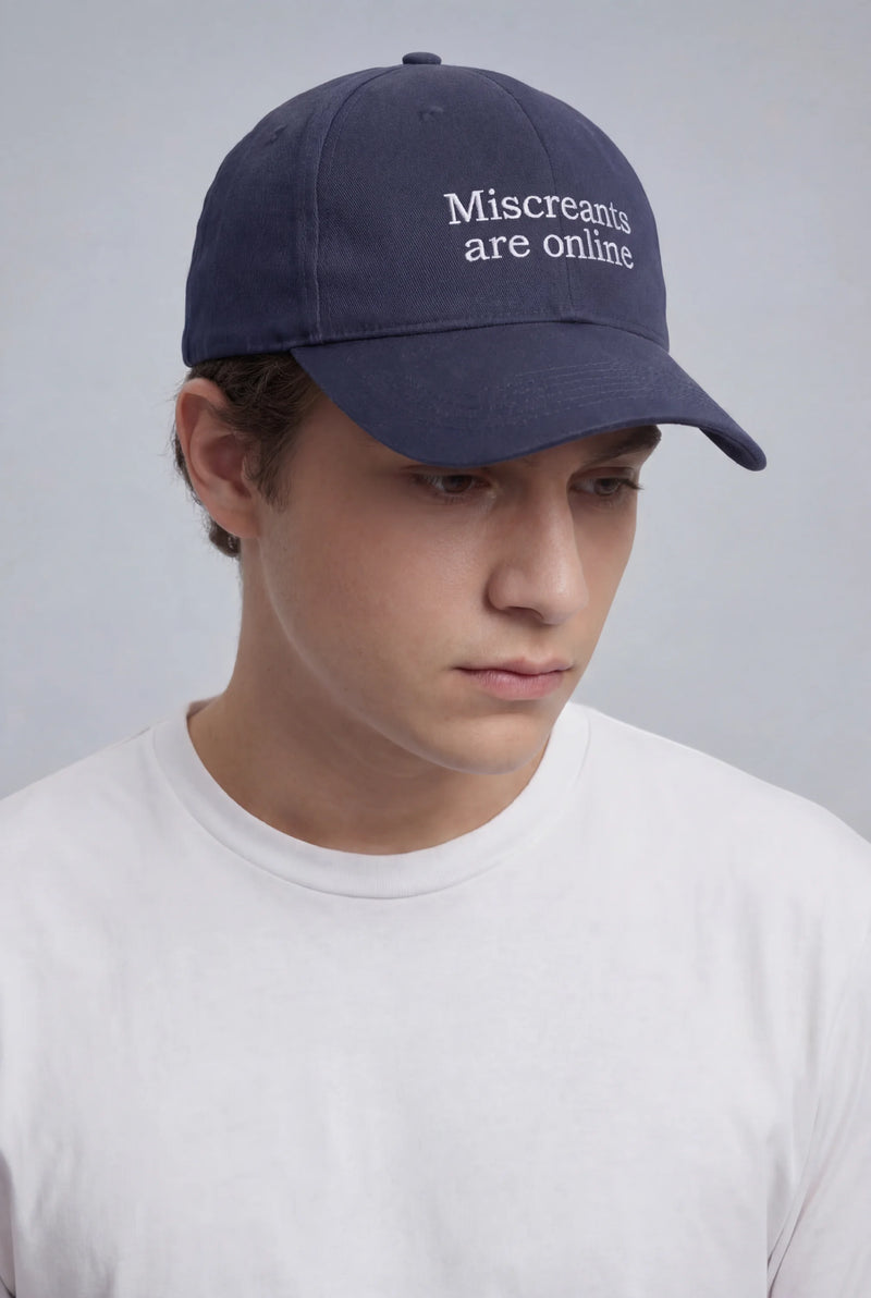 Online Hat - Navy embroidered cap from Miscreants — angled view